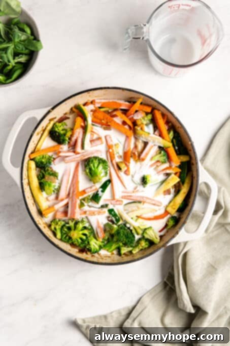 Effortless Thai Green Curry 10 Cooked vegetables bathed in coconut milk, simmering to create the rich curry sauce.