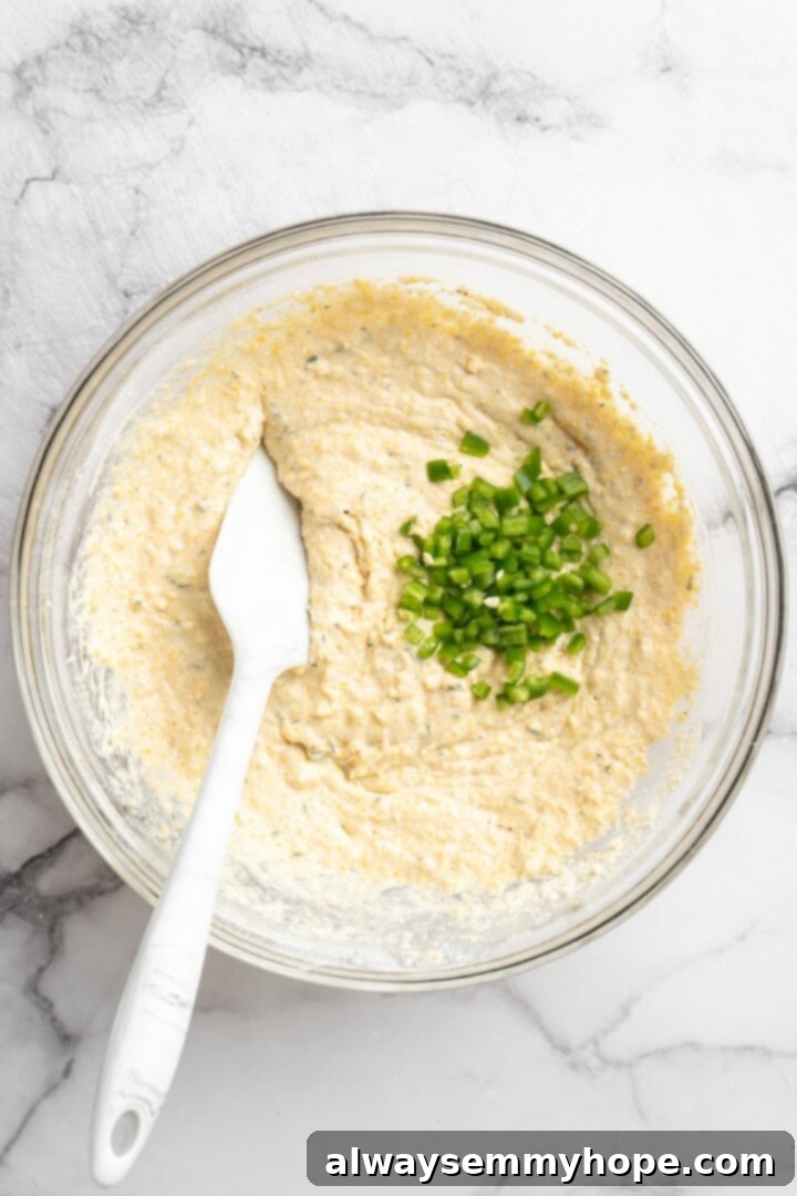 Jalapenos added to bowl of cornbread waffle batter