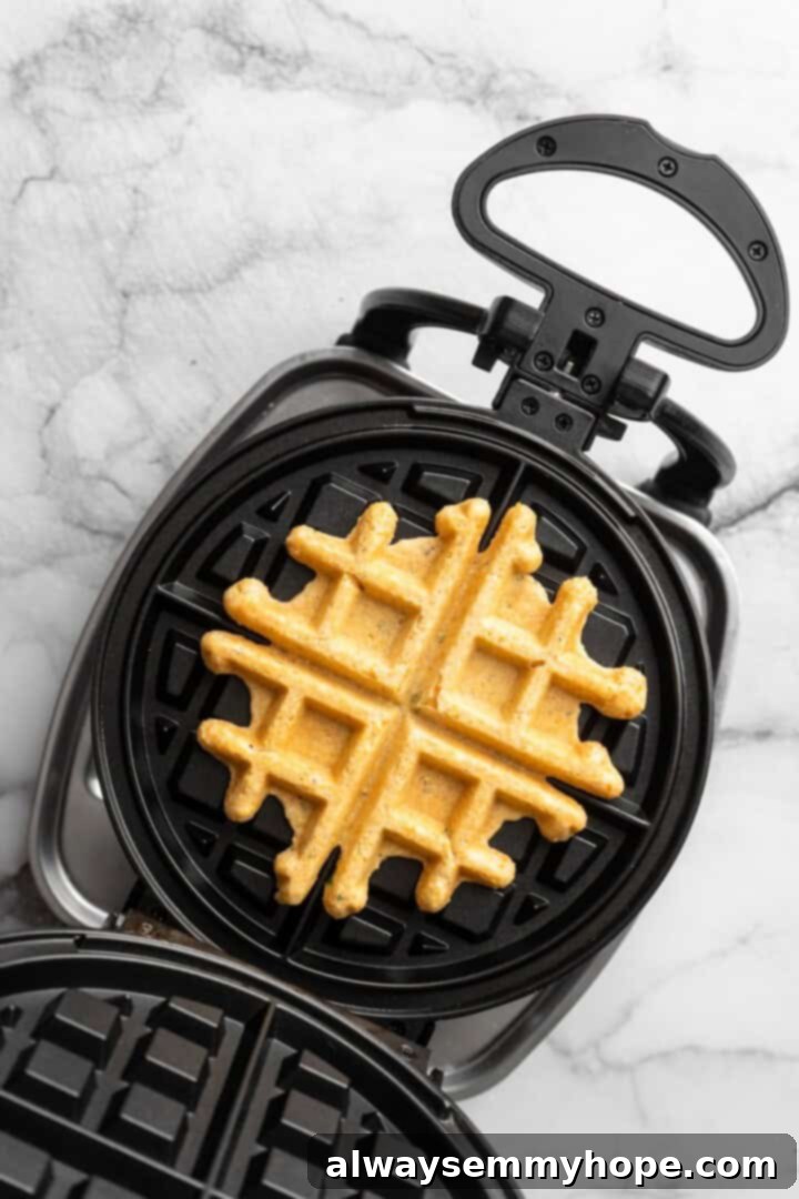 Overhead view of cornbread waffle in waffle maker