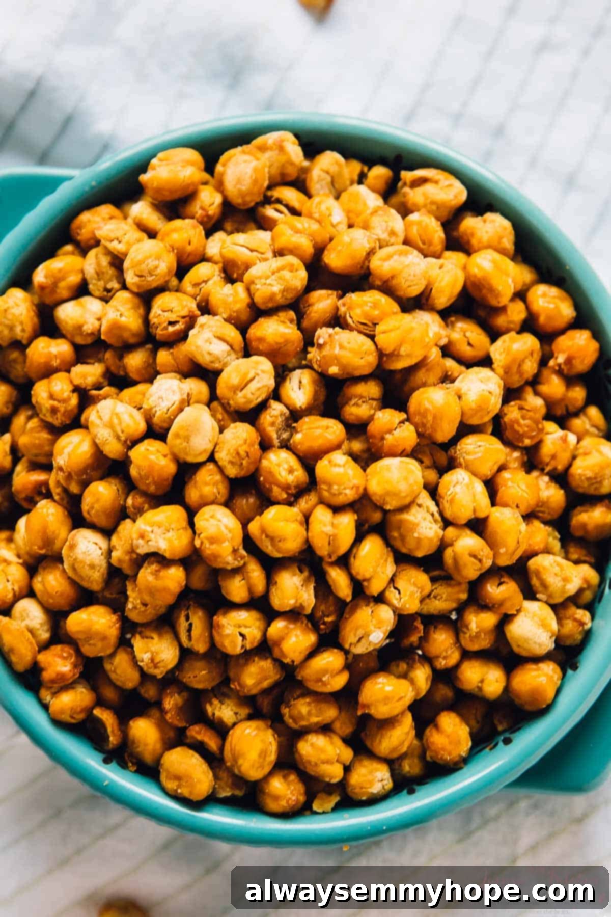 Large bowl of golden-brown crispy roasted chickpeas ready to be enjoyed.