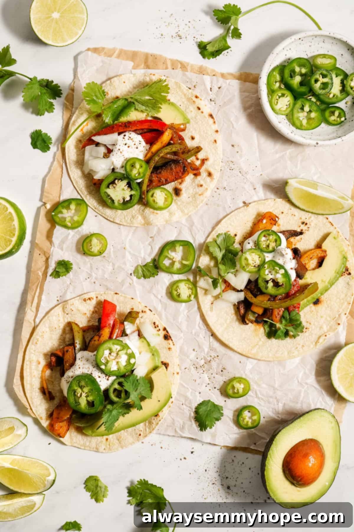 Meaty portobello mushrooms make the best vegan fajitas, sautéed with tender bell peppers and homemade fajita seasoning. Ready in 30 minutes! Soft taco shells with portobello mushrooms and bell pepper.