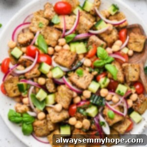 Rustic Chickpea Panzanella 6 This Chickpea Panzanella Salad pairs crispy cubes of bread with chickpeas, veggies, and a zippy mustard balsamic vinaigrette. It’s a salad that eats like a meal!