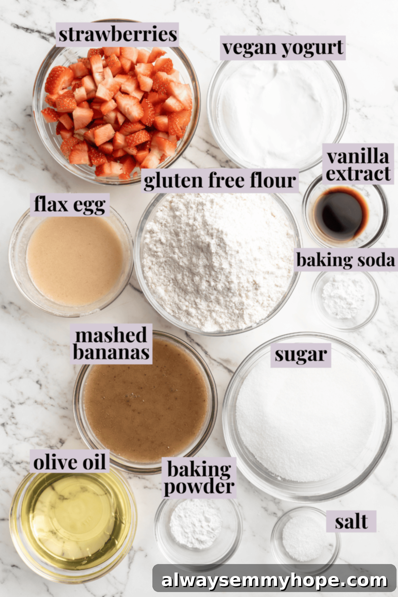 Overhead view of fresh ingredients for gluten-free vegan strawberry banana bread, neatly arranged with labels.