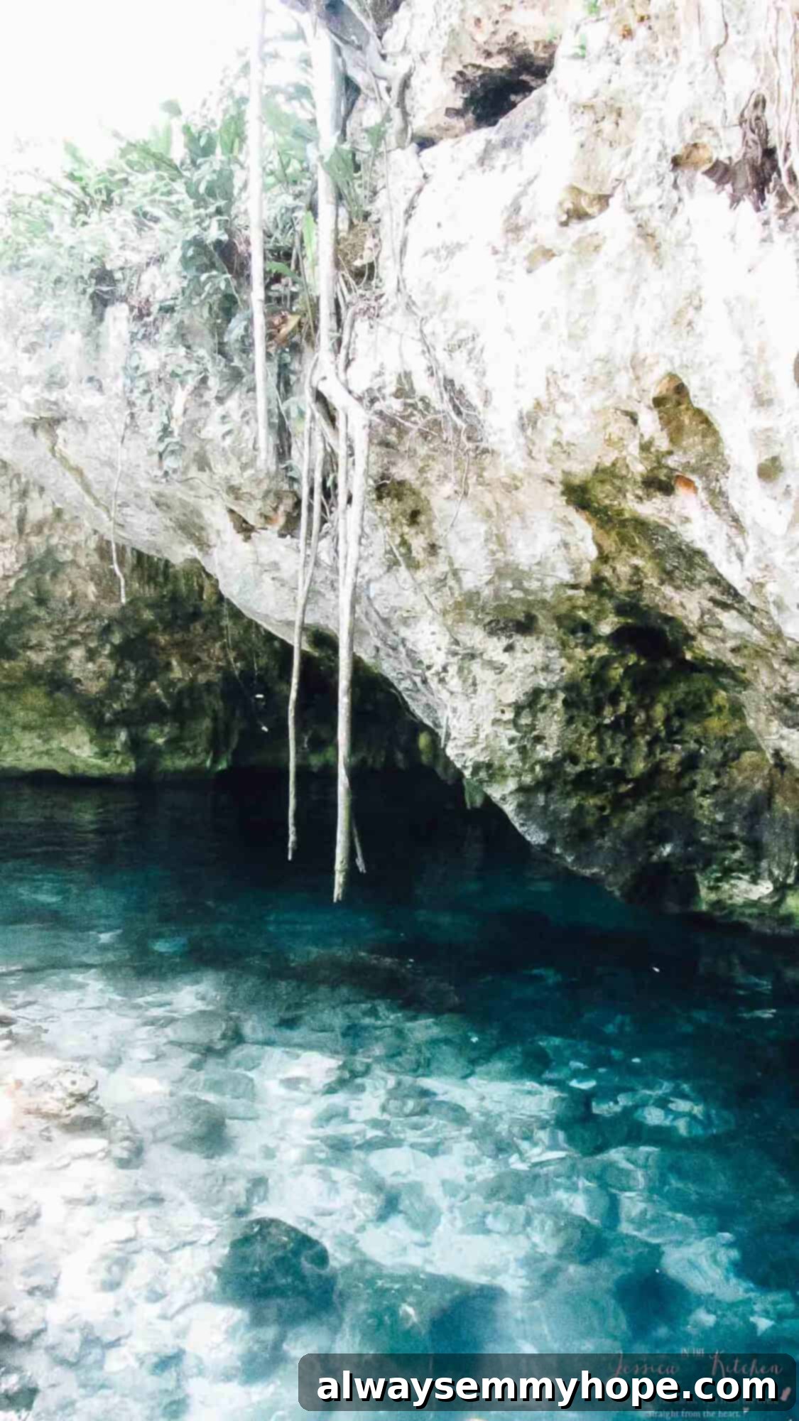 Tulum's Best Eats and Essential City Guide 16 A rock cove with blue water under it.