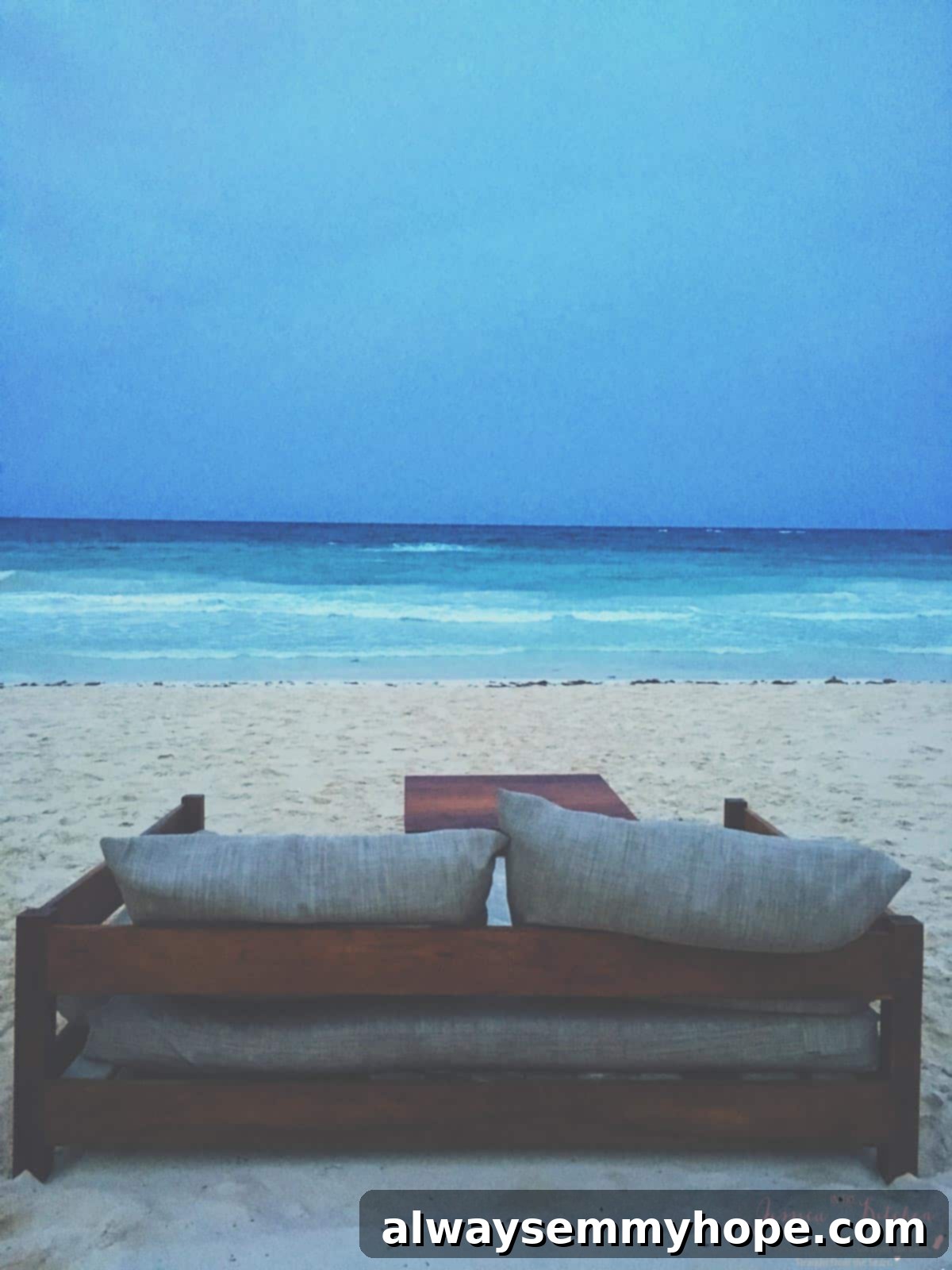 Tulum Eats Your Essential Food and City Guide 18 A couch on a beach.