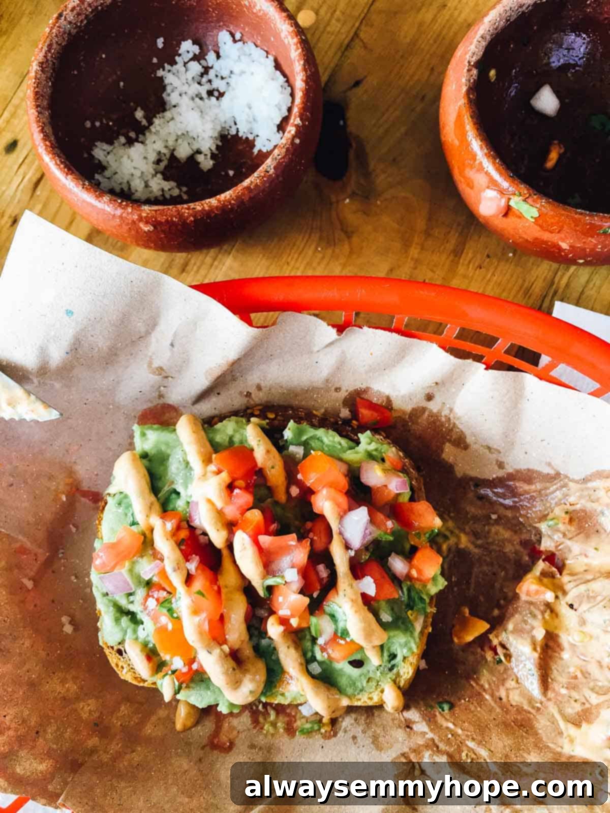 Tulum Eats Your Essential Food and City Guide 6 Top down view of avocado toast in a red basket.