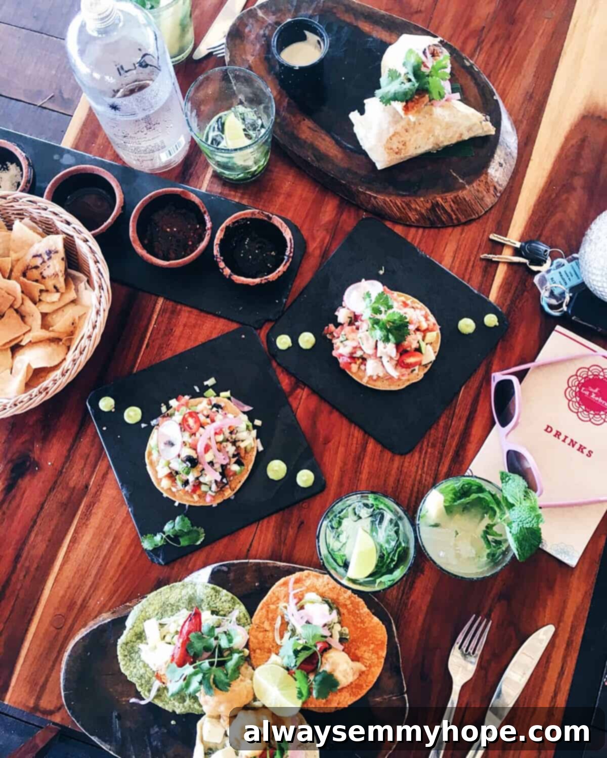 Tulum's Best Eats and Essential City Guide 7 Overhead view of tostadas on a wood table.