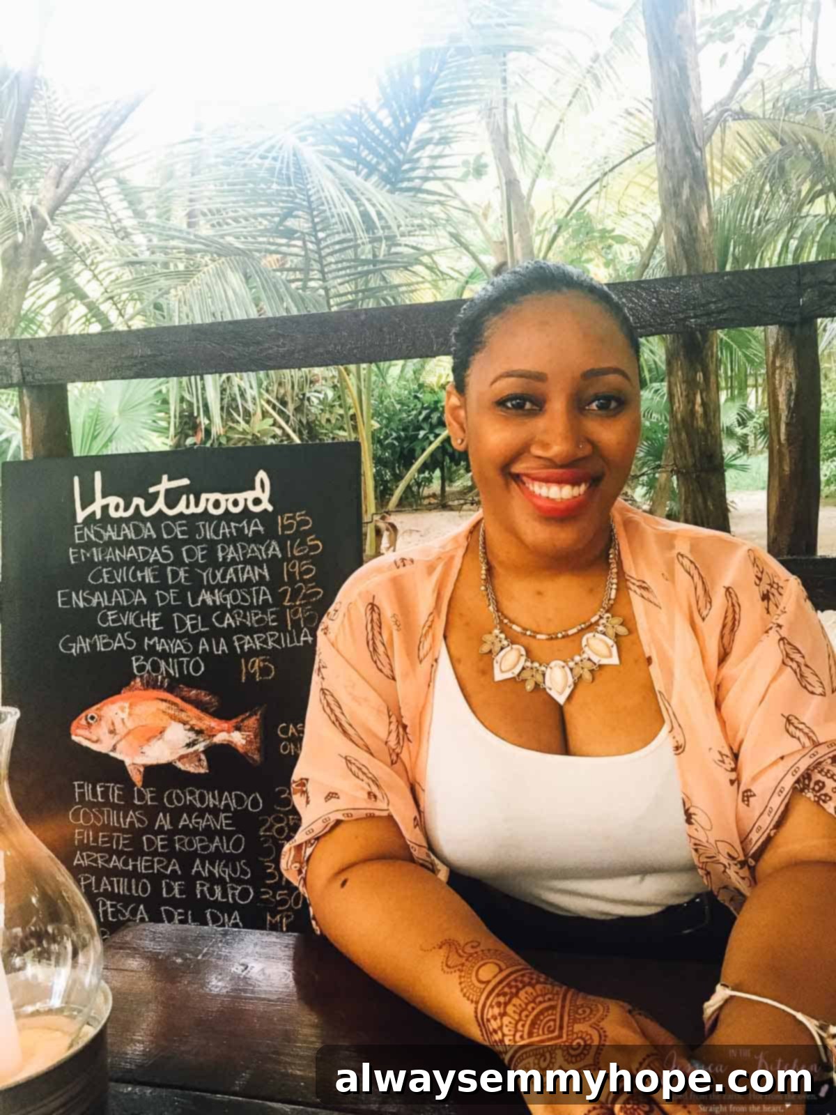 Tulum's Best Eats and Essential City Guide 9 Jessica smiling to camera in a restaurant.