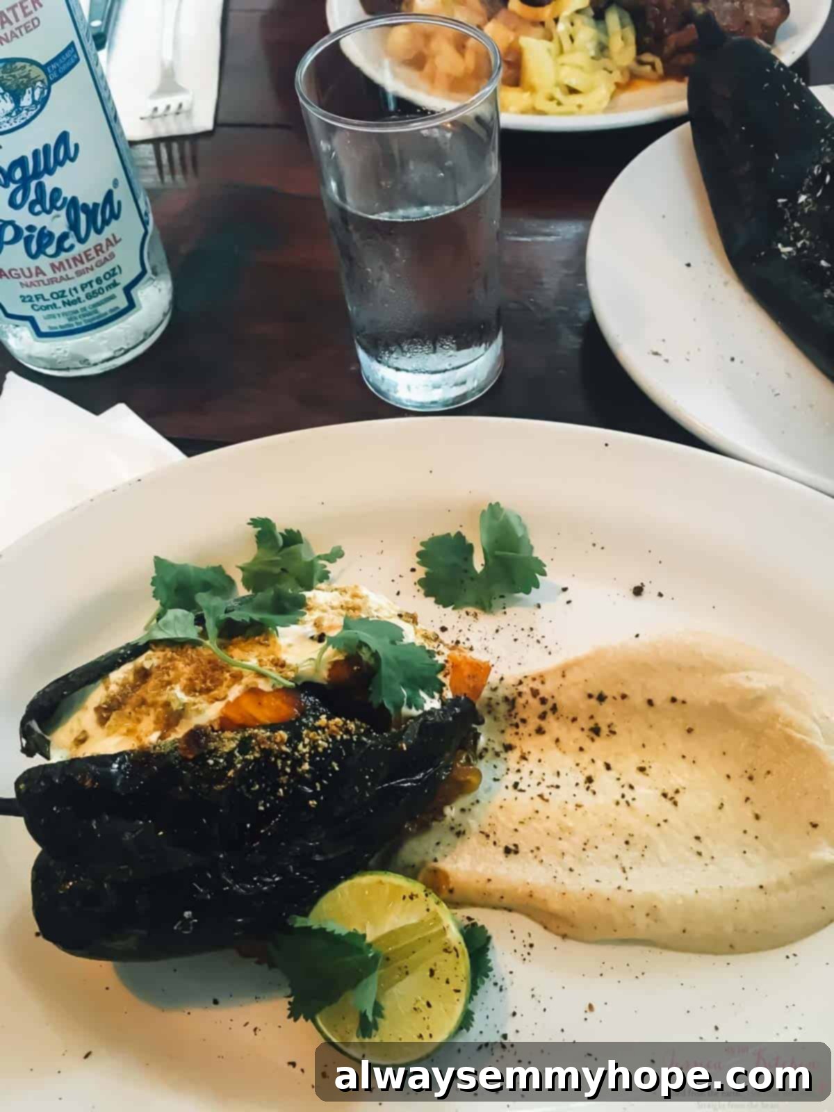 Tulum's Best Eats and Essential City Guide 10 A stuffed pepper on a plate with a lime half.