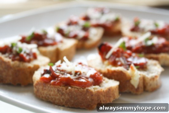 Roasted tomatoes produce an absolutely delicious home-made version of sun-dried tomatoes, resulting in Homemade Sundried Tomatoes Bruschetta. Homemade Sundried Tomatoes Bruschetta's on a white tray.