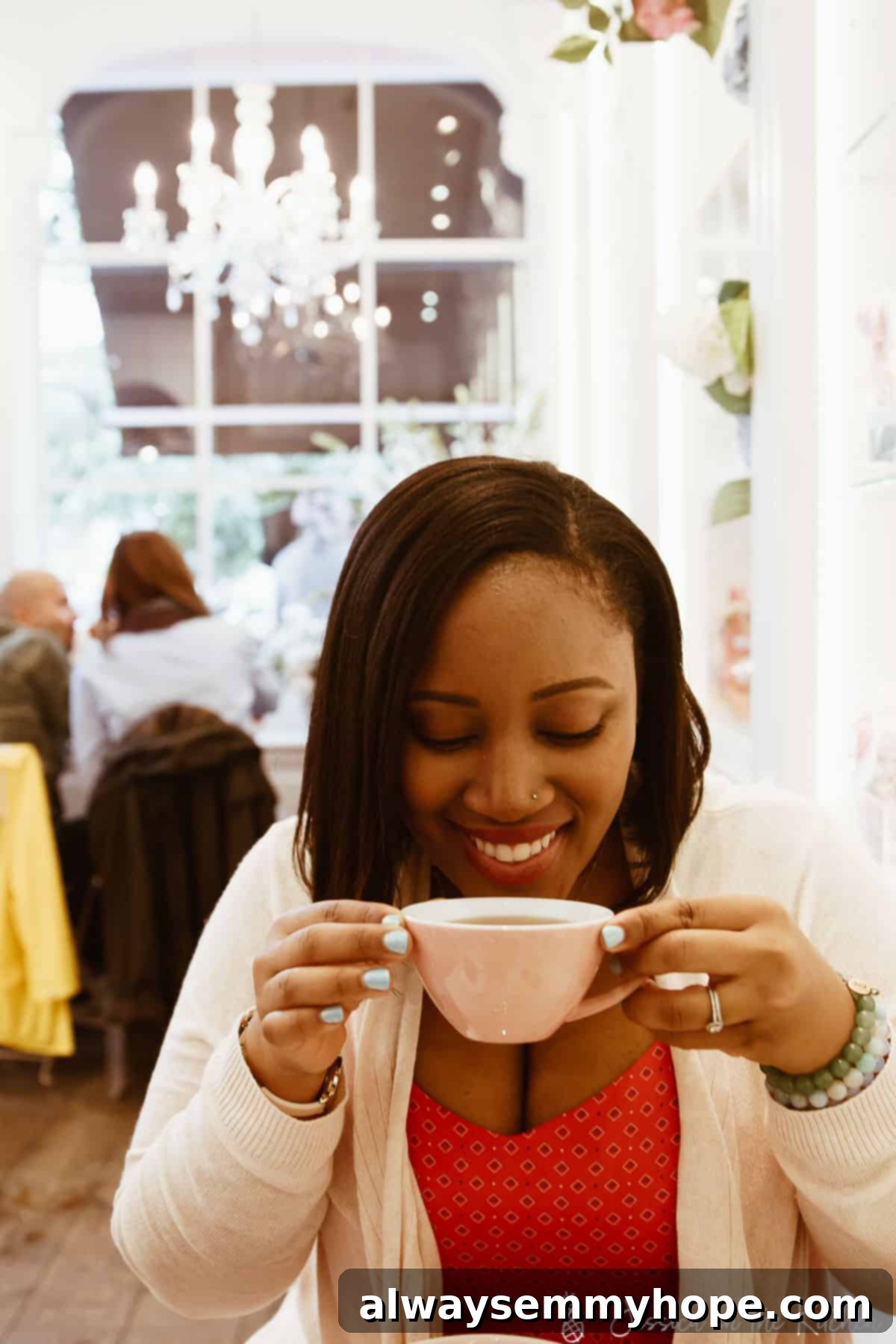 The Art of Slow: Savasana for Self-Care 2 Jessica drinking a cup of coffee in a restaurant.
