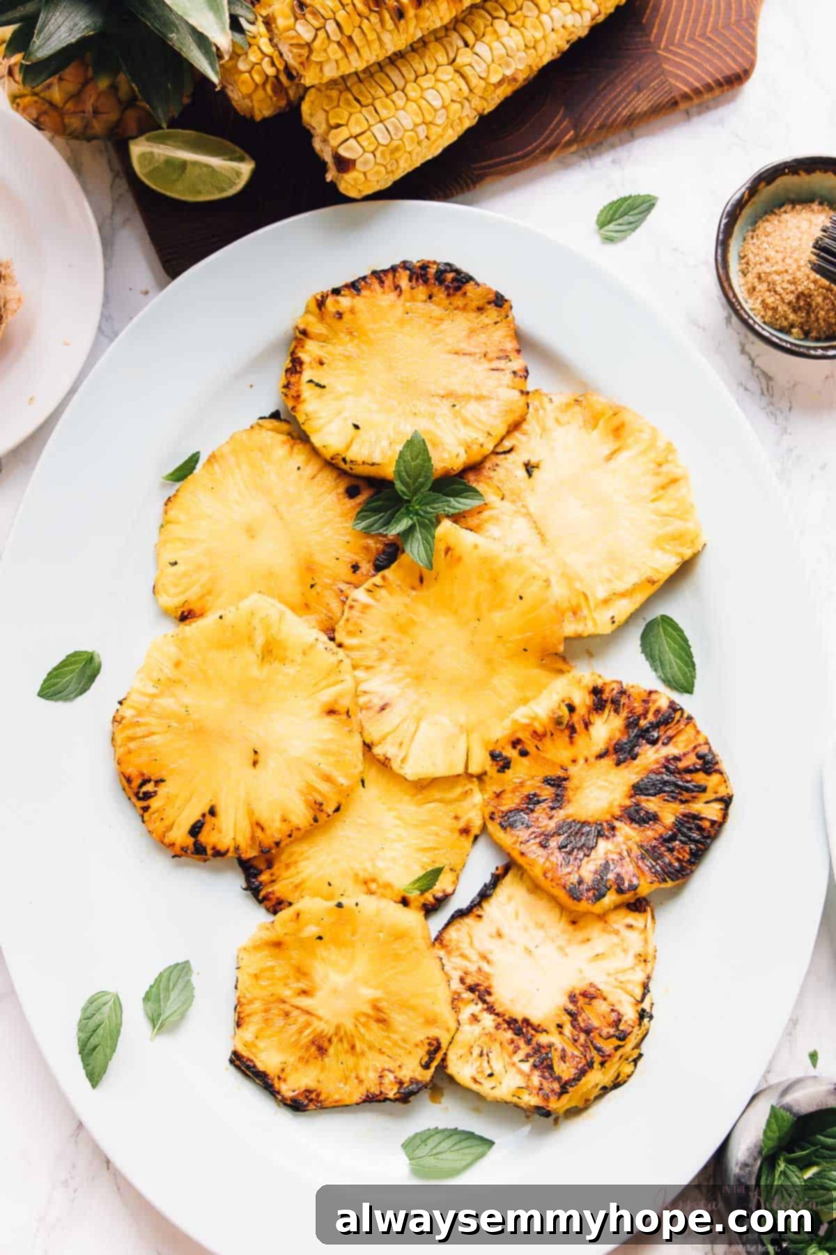 The Art of Slow: Savasana for Self-Care 3 Overhead view of grilled pineapples on a long white plate.