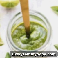 Top down shot of vegan pesto in a glass jar.