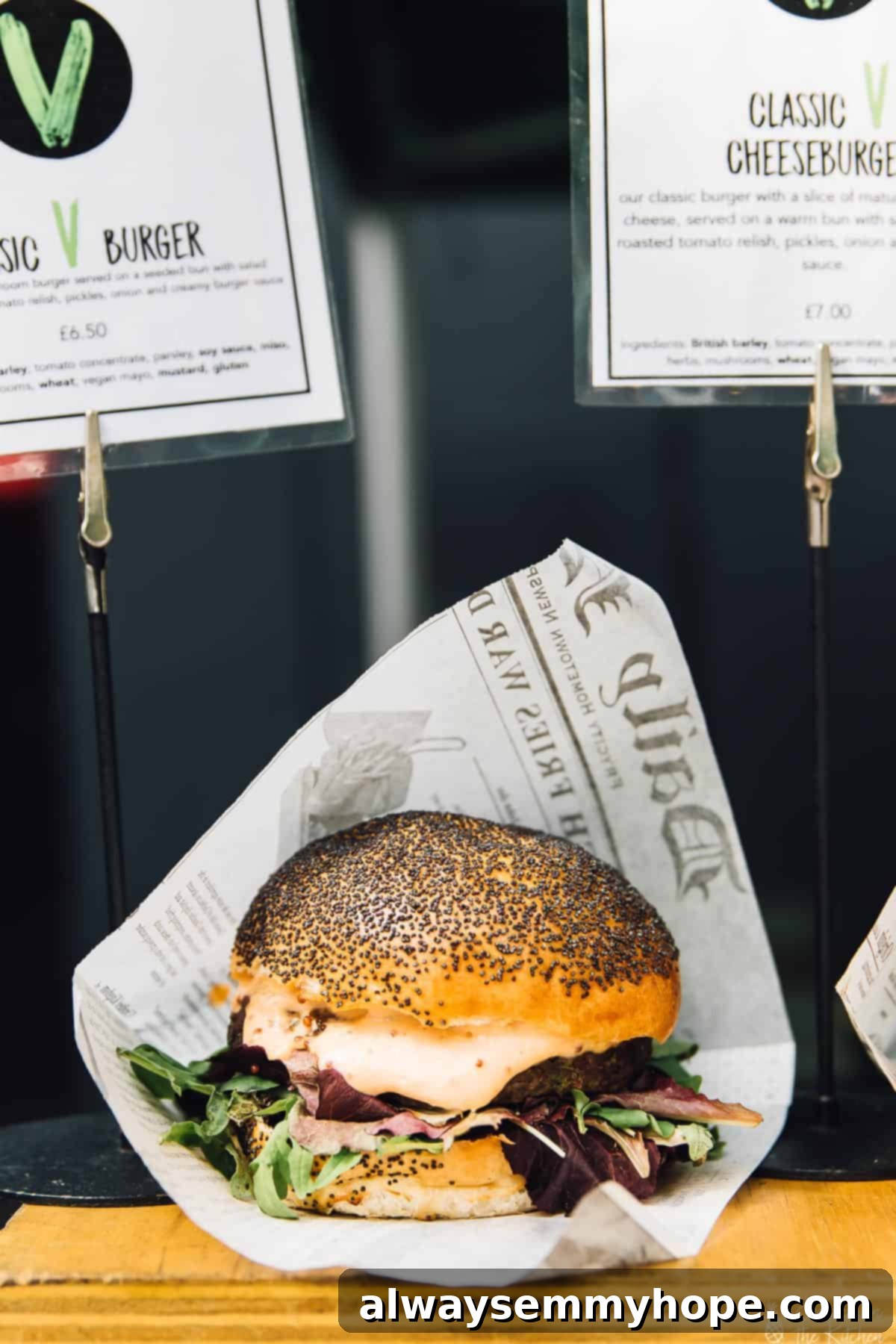 Your Essential Guide to London Food and Exploration 13 A close-up side shot of a perfectly crafted burger, wrapped in newspaper, from Big V London.