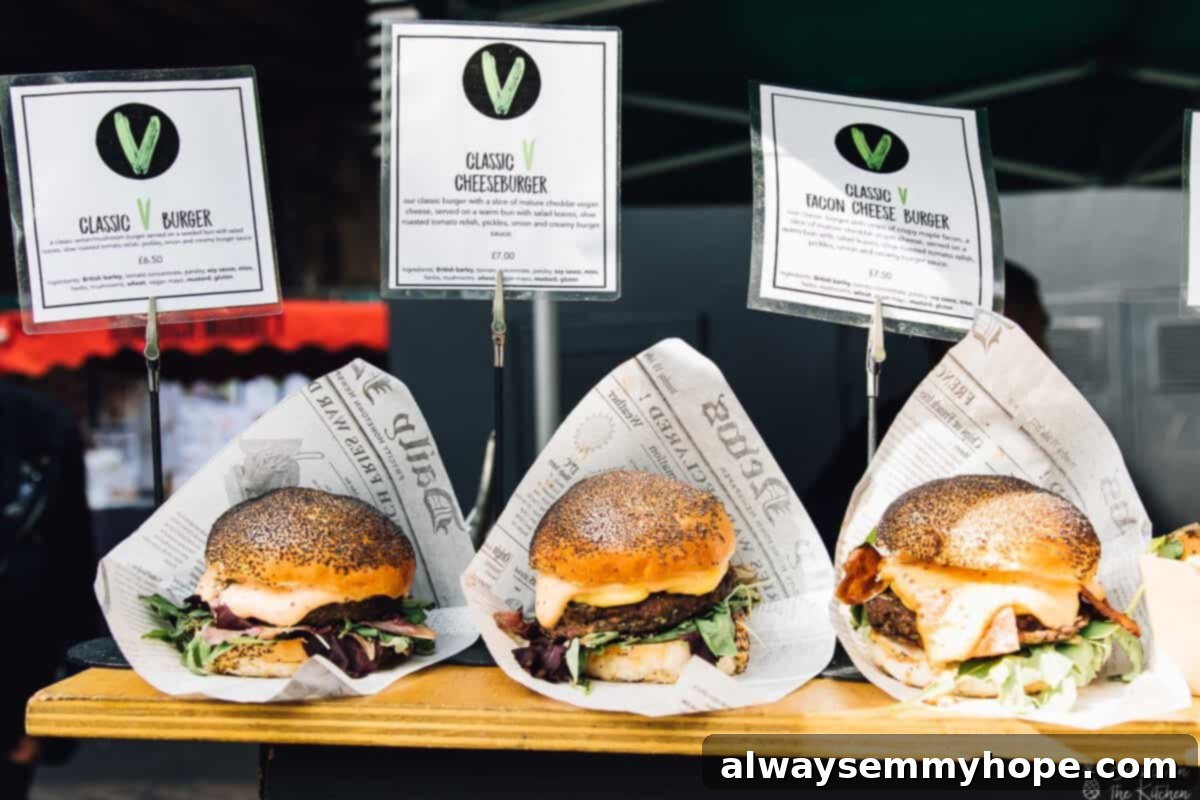 Your Essential Guide to London Food and Exploration 24 Three delicious burgers artfully arranged on a rustic wooden plank, a feast for the eyes.