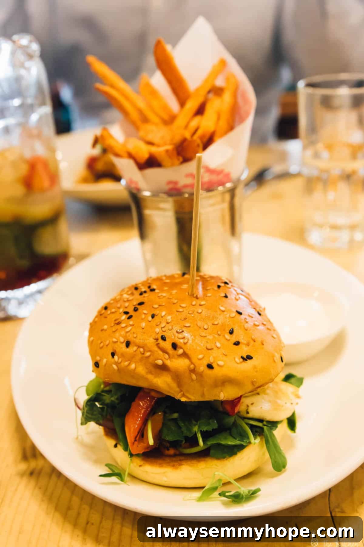 Your Essential Guide to London Food and Exploration 8 A delicious burger on a plate with crispy fries in the background at Bill's restaurant.