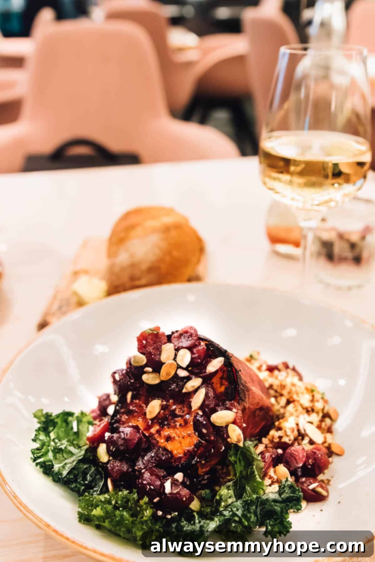 Your Essential Guide to London Food and Exploration 9 An elegantly plated dish of delicious food on a white plate in a stylish restaurant setting.