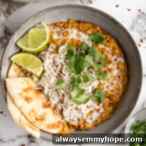 Creamy One-Pot Red Lentil Curry 3 Bowl of red lentil curry with naan and rice
