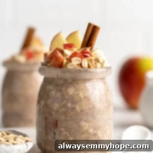 No-Bake Apple Pie Oats 5 two jars apple overnight oats with cinnamon sticks, oats and apples topping them