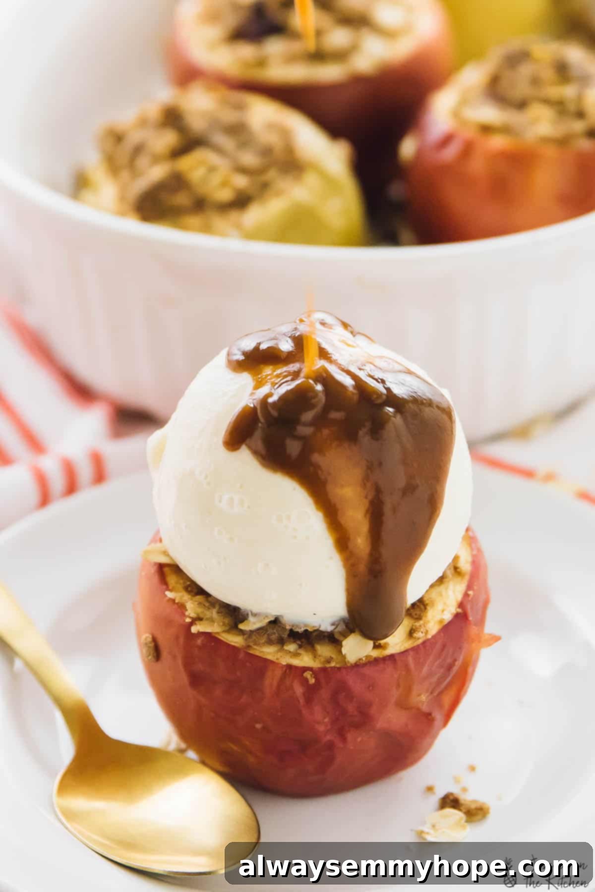 Indulge in a warm baked apple with ice cream and caramel sauce. A beautifully baked apple, steaming hot from the oven, adorned with a melting scoop of vanilla ice cream and generously drizzled with rich caramel sauce, ready to be enjoyed.