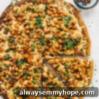 Plant-Powered Fiery BBQ Chickpea Pizza 2 Overhead view of whole spicy BBQ chickpea pizza with two slices pulled away slightly