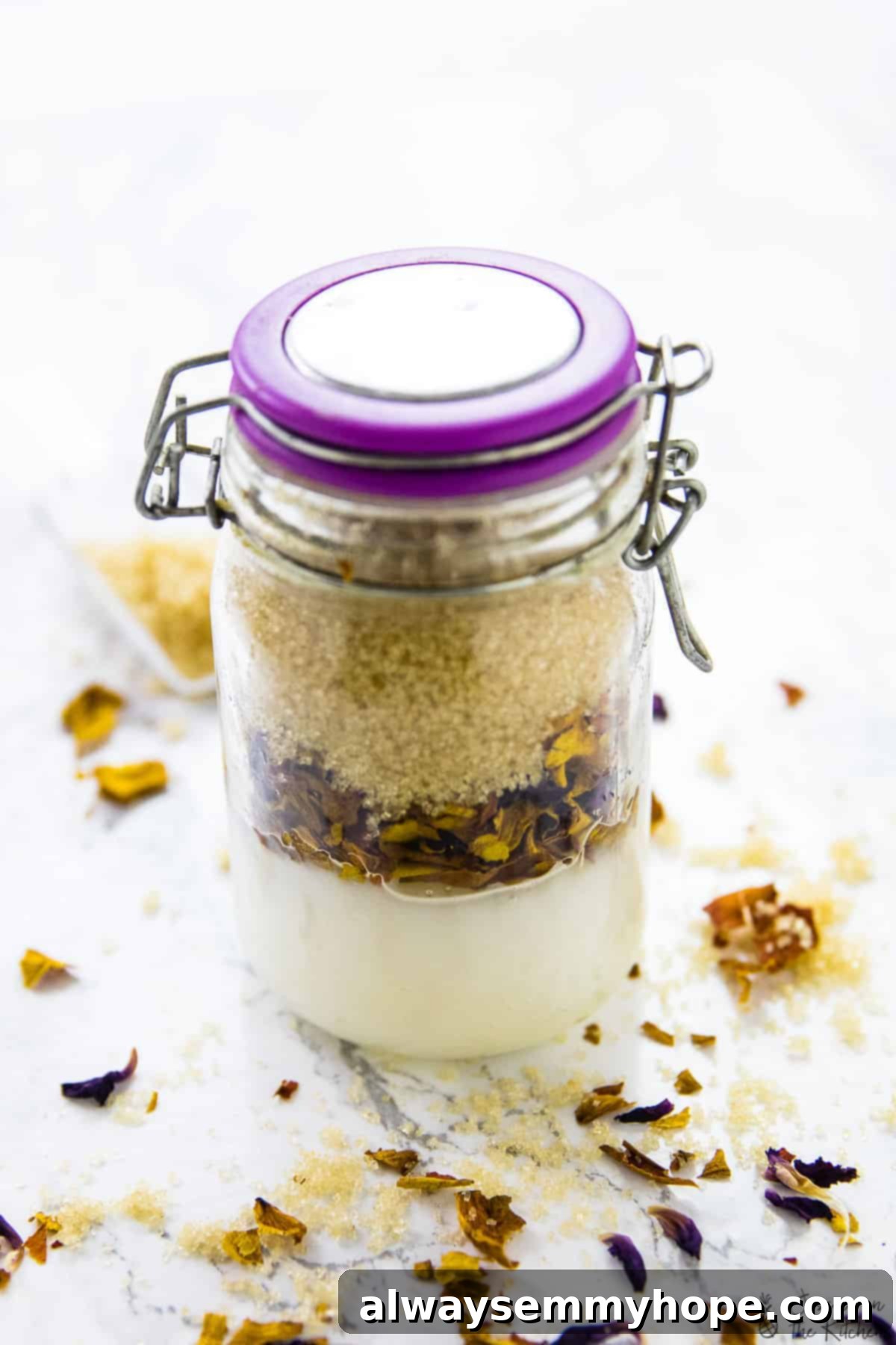 The finished coconut rose sugar scrub in a closed glass jar, ready for use or gifting.