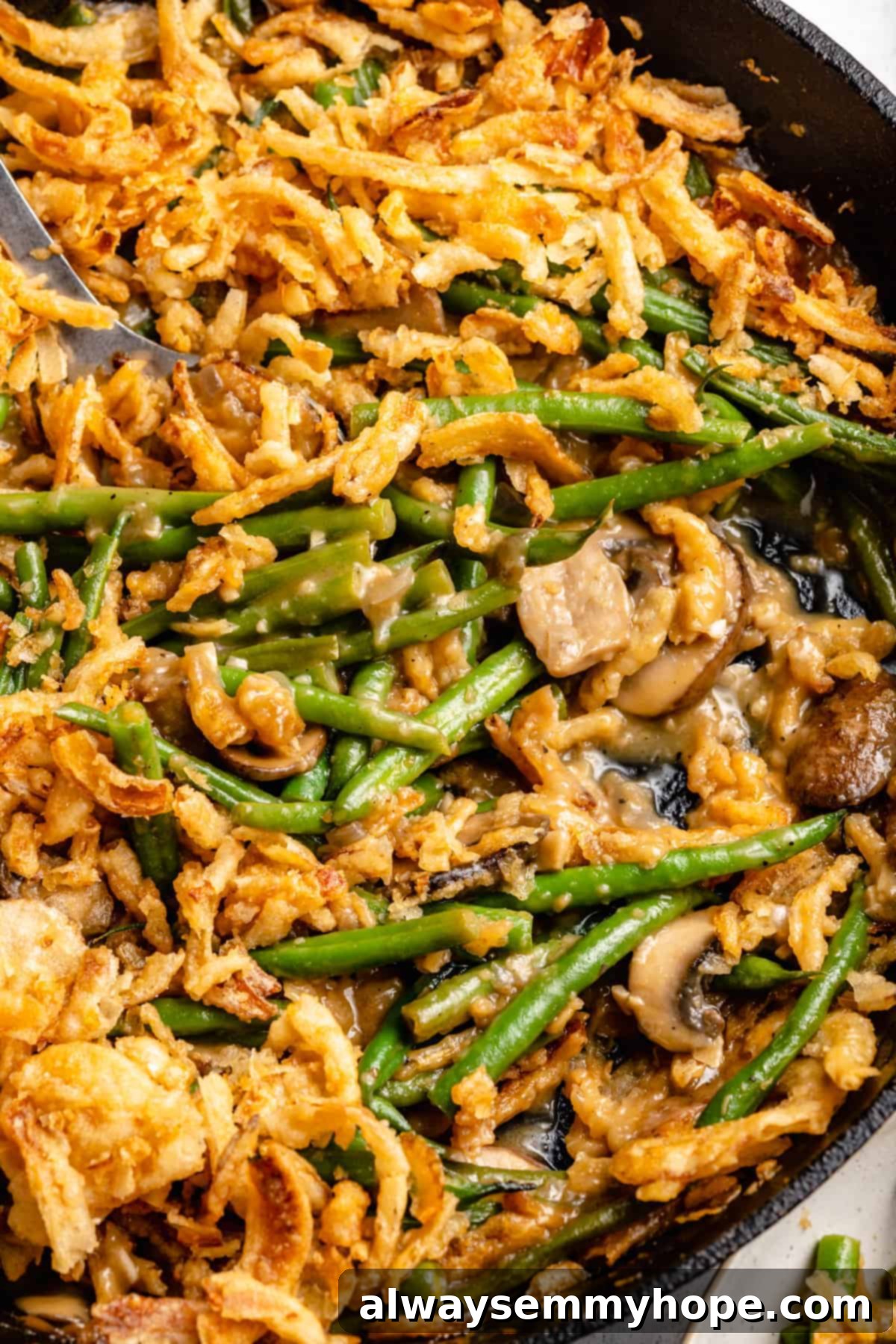 Closeup of green bean casserole in cast iron skillet