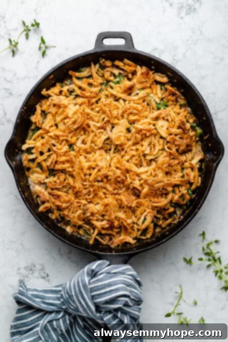 Overhead view of finished green bean casserole in skillet