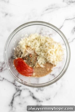 Ingredients for vegan cauliflower pizza bites in a glass bowl, ready to be mixed, showcasing vibrant colors and fresh textures.