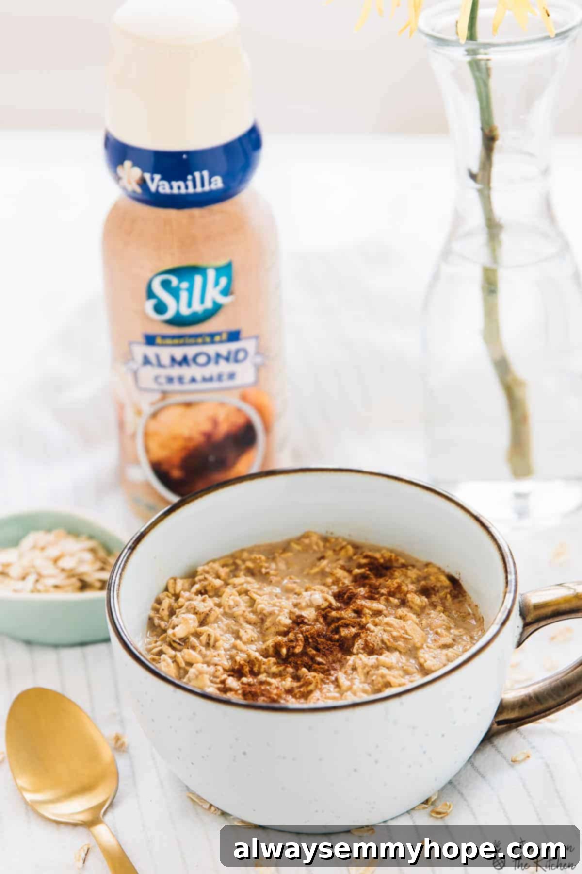 Spiced Espresso Overnight Oats 19 A beautifully presented cup of Espresso Cinnamon Overnight Oats, topped with a swirl of almond creamer and a dusting of cinnamon, ready to be enjoyed.