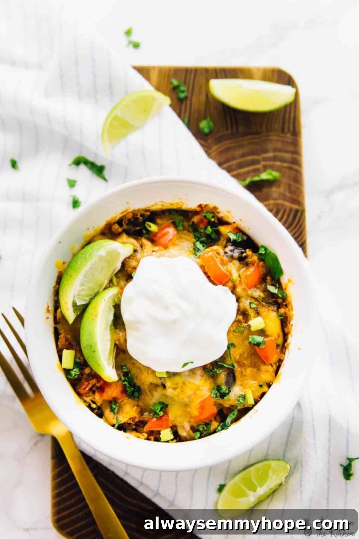 An overhead view of a hearty slow cooker quinoa enchilada casserole, served in a white ramekin, ready to be enjoyed.