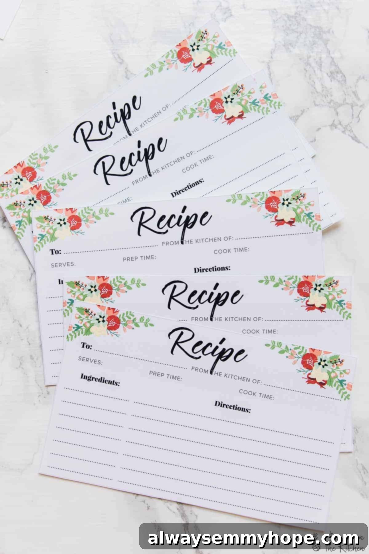 Free Printable Recipe Cards, Just For You 4 A bunch of printed recipe cards fanned out on a white table.