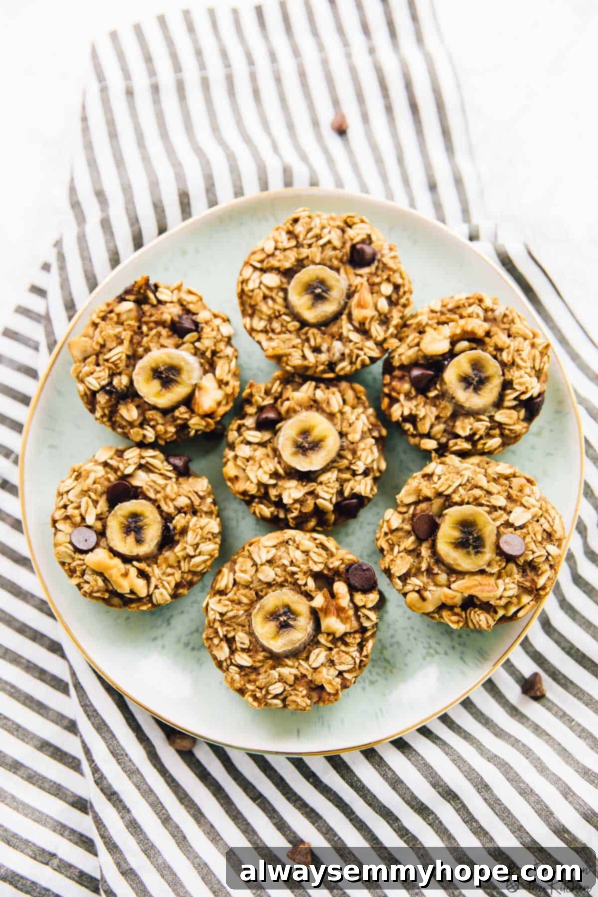 Top down view of baked banana bread oatmeal cups on a vibrant green plate, showcasing their inviting texture.