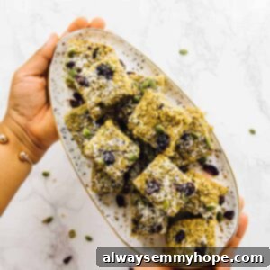 My Progress Morning Routine Featuring Quinoa Breakfast Bars 15 Overhead view of hands holding a plate of breakfast bars.