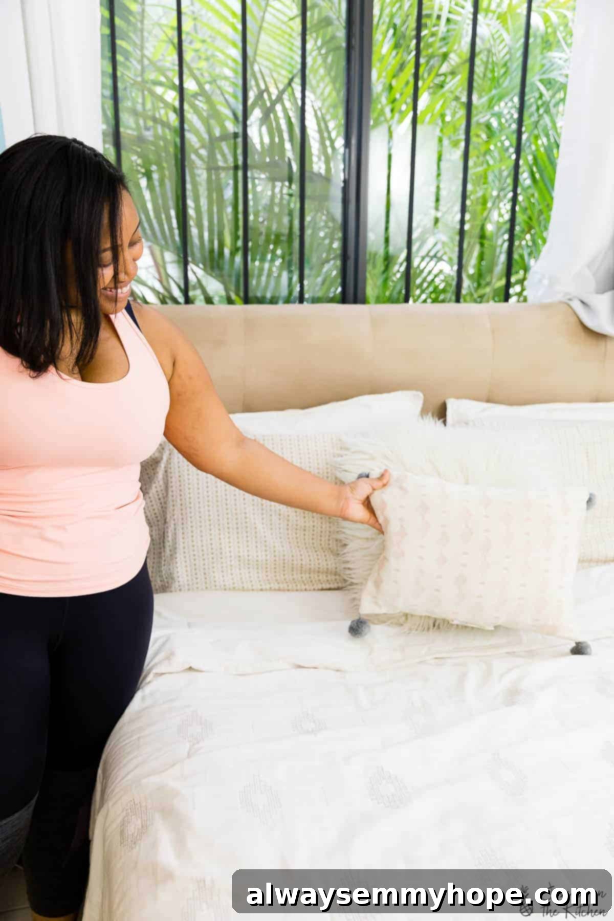 My Progress Morning Routine Featuring Quinoa Breakfast Bars 4 Jessica tidying her bed, emphasizing the start of her disciplined morning routine.