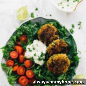 Golden Quinoa Fritters with Smooth Tahini Dressing 2 Top down shot of crispy quinoa patties on a bed of greens.