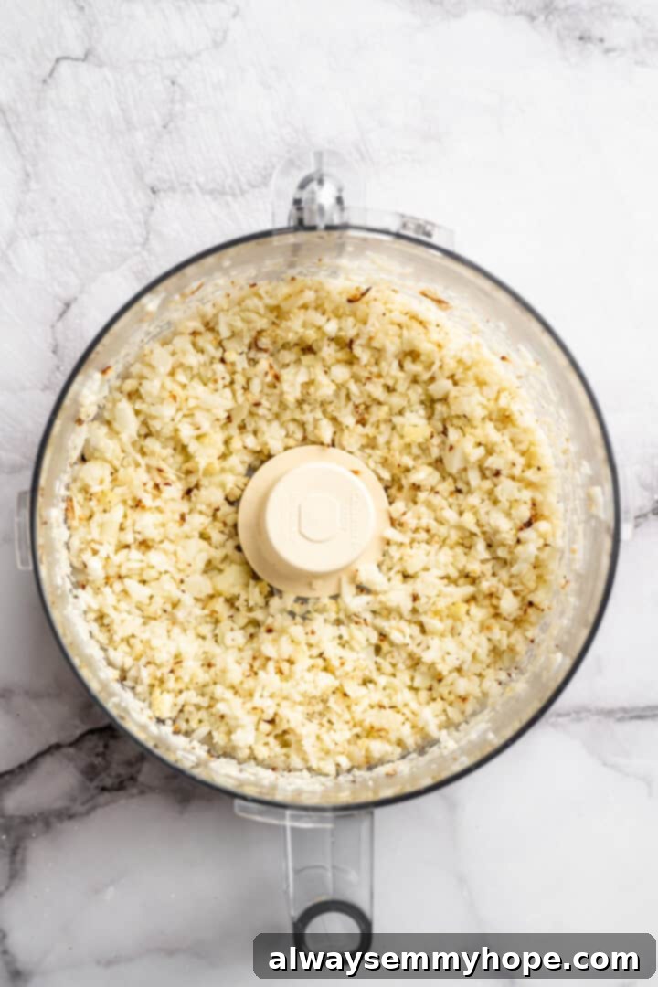 Chopped cauliflower in food processor.