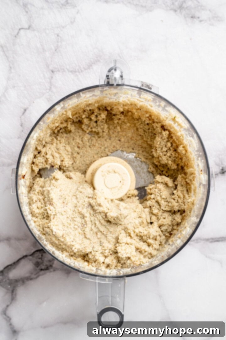 Mixture for vegan Buffalo cauliflower meatballs in food processor.