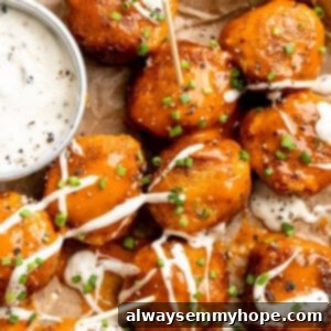 Buffalo-Style Vegan Quinoa Cauliflower Meatballs 5 Sheet pan with Buffalo cauliflower meatballs and vegan ranch.
