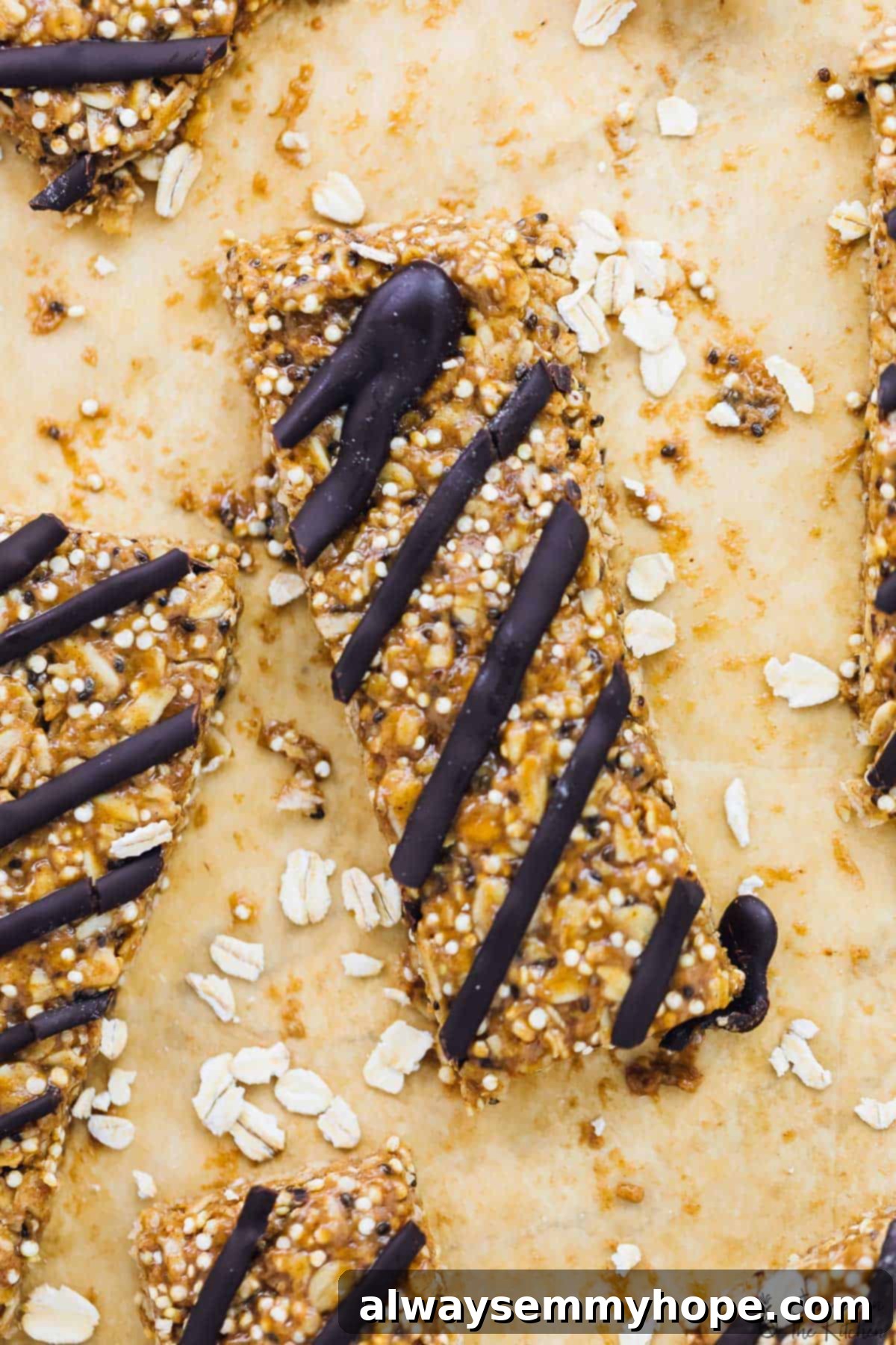No-Bake Salted Honey Dark Chocolate Quinoa Coconut Delights 6 Overhead view of several perfectly cut salted honey, dark chocolate, coconut, and quinoa no-bake granola bars arranged neatly on a light wooden cutting board, ready to be enjoyed as healthy snacks.