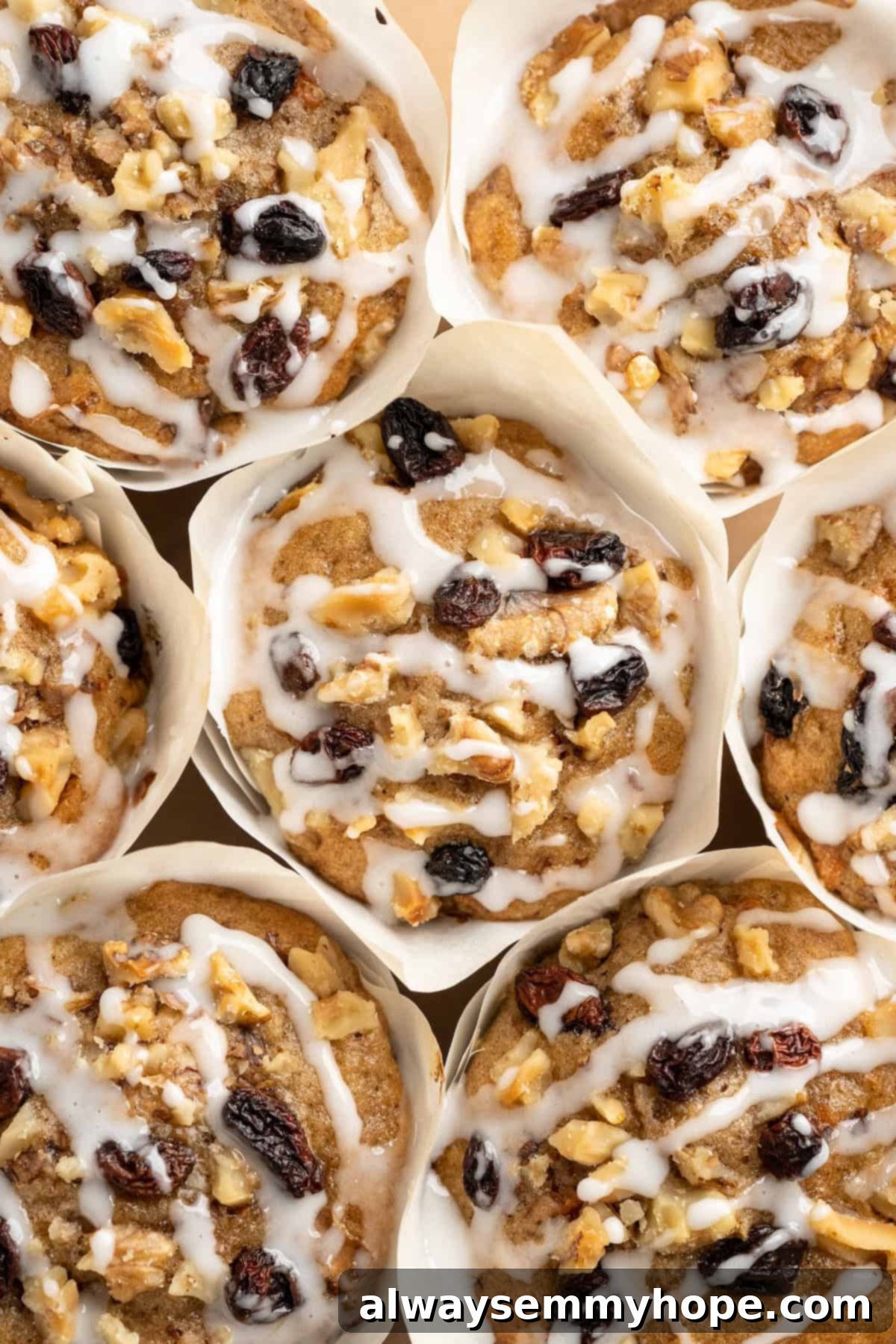 These easy carrot cake muffins bake up in just 30 minutes and are absolutely fantastic. Moist, delectable, vegan and gluten-free! Overhead view of vegan carrot cake muffins