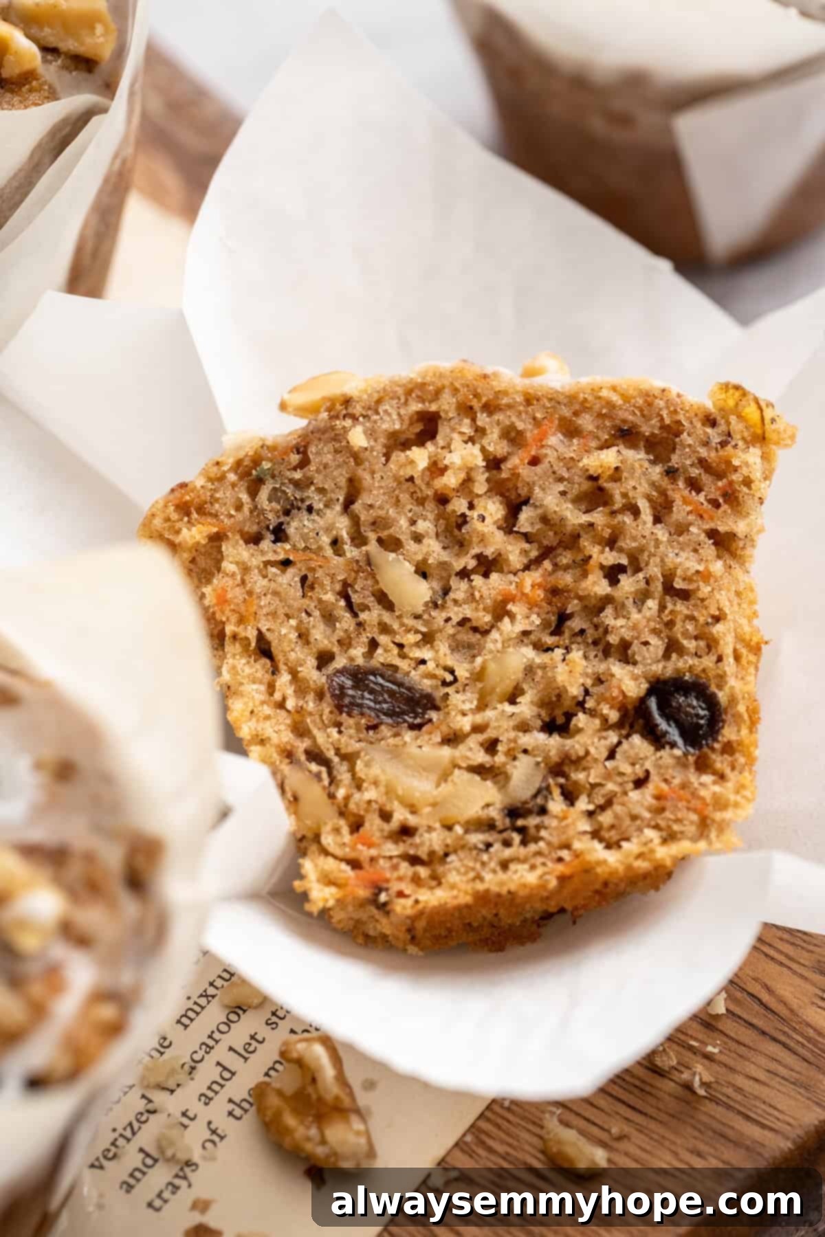 These easy carrot cake muffins bake up in just 30 minutes and are absolutely fantastic. Moist, delectable, vegan and gluten-free! Carrot cake muffin sliced in half to show moist texture