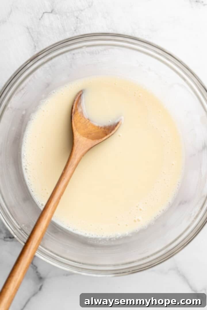 These easy carrot cake muffins bake up in just 30 minutes and are absolutely fantastic. Moist, delectable, vegan and gluten-free! Stirring buttermilk into wet ingredients in bowl