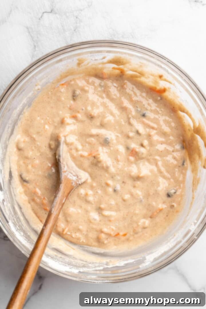 These easy carrot cake muffins bake up in just 30 minutes and are absolutely fantastic. Moist, delectable, vegan and gluten-free! Carrot cake muffin batter in bowl