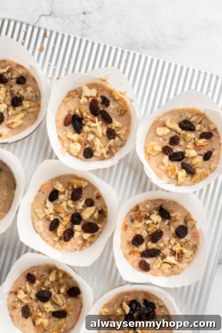 These easy carrot cake muffins bake up in just 30 minutes and are absolutely fantastic. Moist, delectable, vegan and gluten-free! Carrot cake muffins in pan before baking