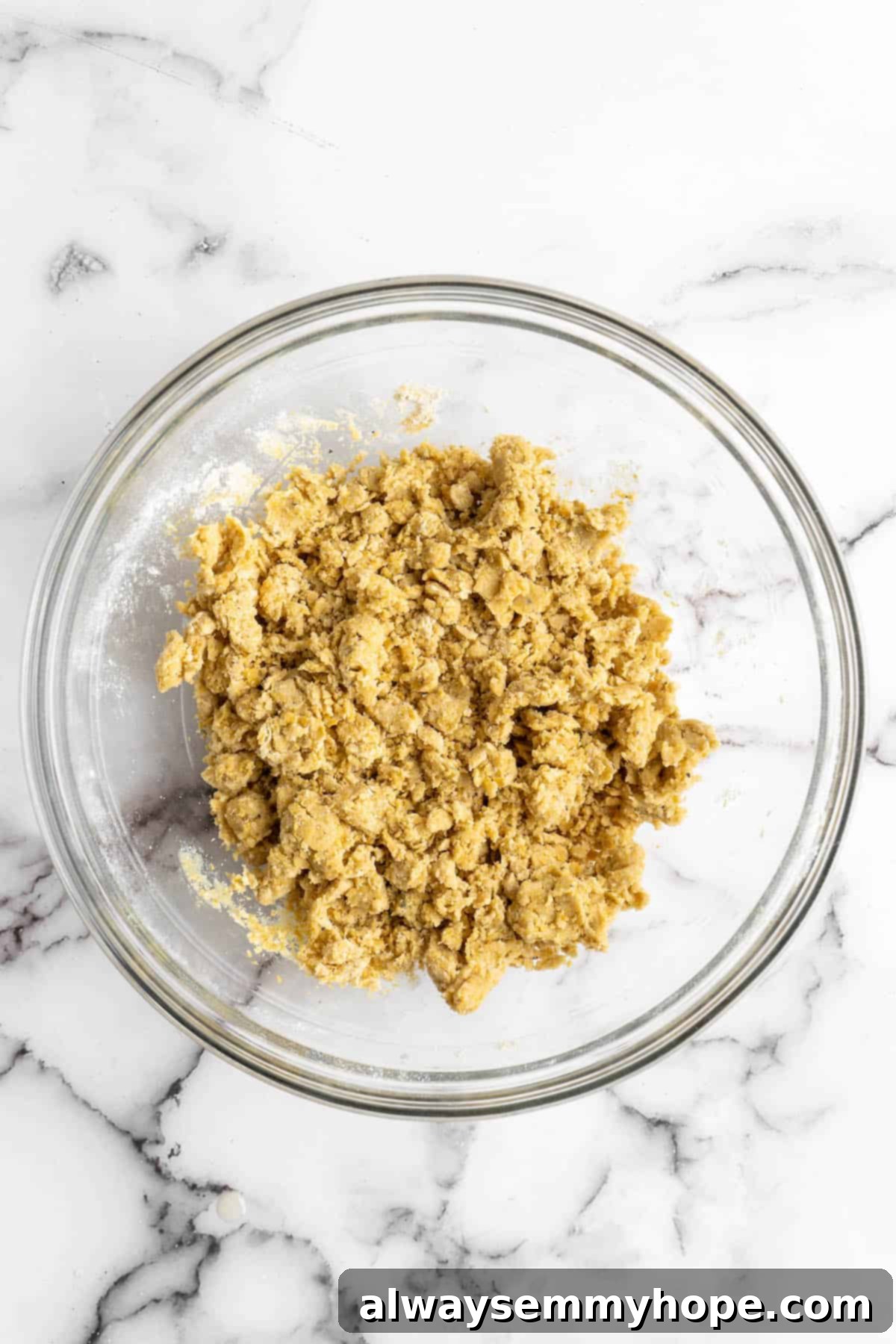 These vegan Cheez-Its are crispy, crunchy, snackable, and super cheesy! Make your own homemade vegan cheese crackers in just 30 minutes. Vegan cheez-it dough in glass bowl