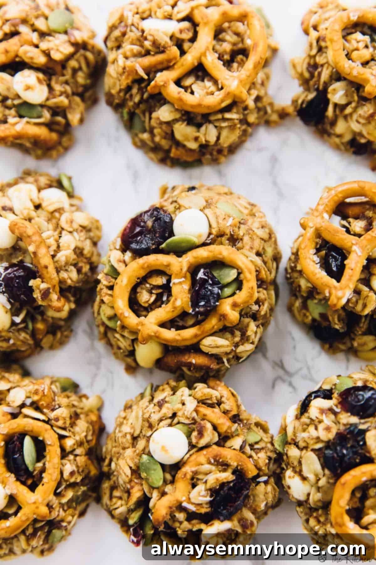 Chewy peanut butter banana oatmeal cookies are perfect for breakfast, snacks, and anytime you need a little boost in your day. So easy too! Overhead view of peanut butter banana oatmeal cookies with pretzels