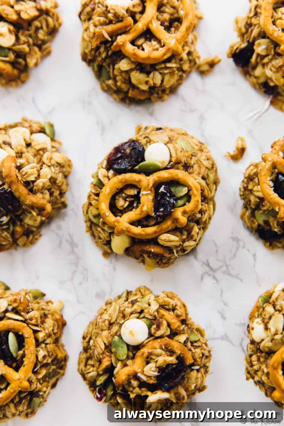 Chewy peanut butter banana oatmeal cookies are perfect for breakfast, snacks, and anytime you need a little boost in your day. So easy too! Overhead view of peanut butter banana oatmeal cookies with pretzels
