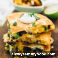 Fiesta Black Bean and Corn Quesadillas 2 Stack of black bean and corn quesadilla wedges on wooden board