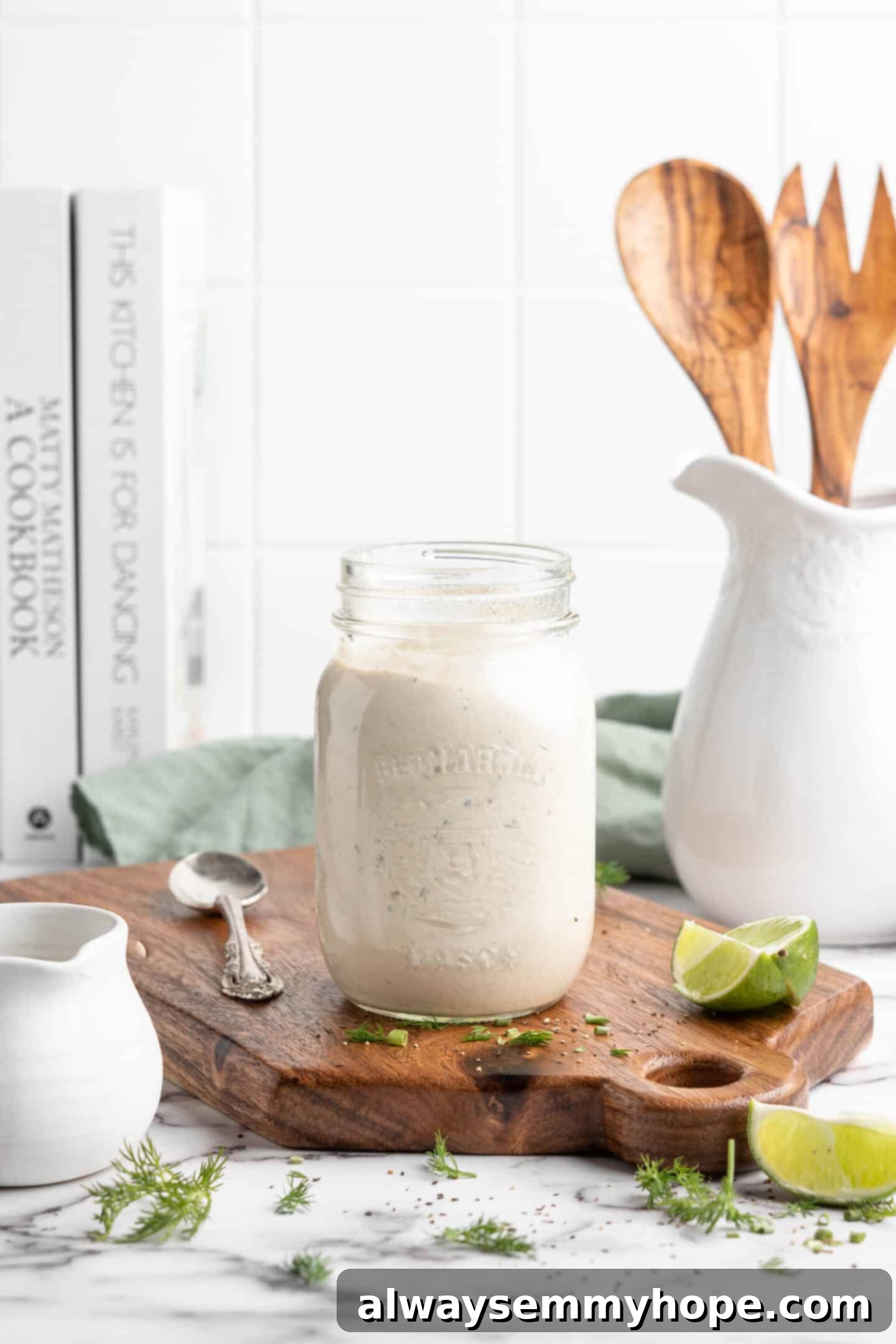 Jar of vegan ranch dressing on wood board